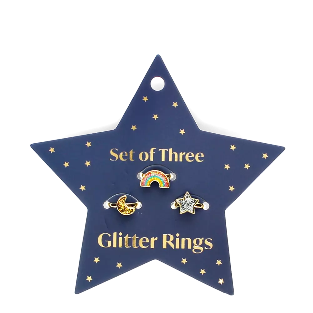 set of three children's rings in rainbow, moon and start shapes. The rings are on a navy blue star shaped card. For children 3 and over. 