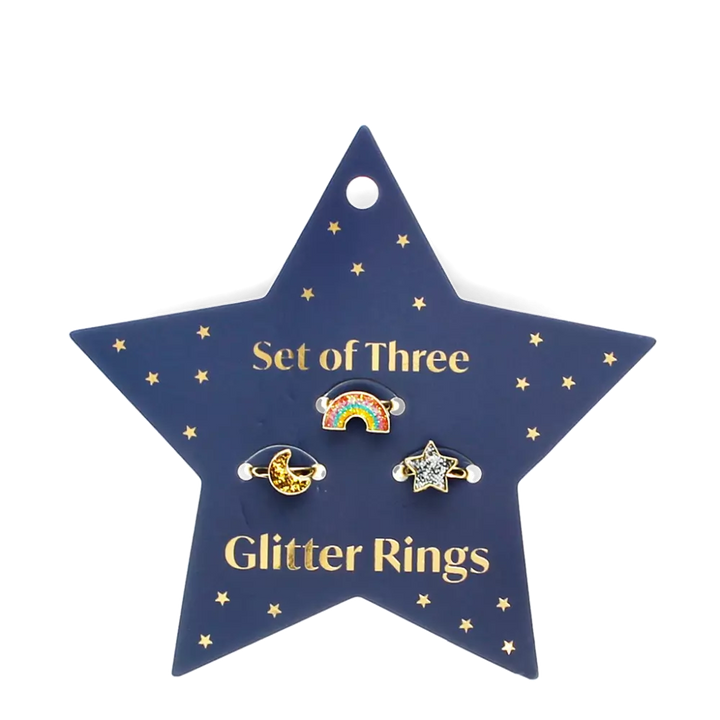 set of three children's rings in rainbow, moon and start shapes. The rings are on a navy blue star shaped card. For children 3 and over. 