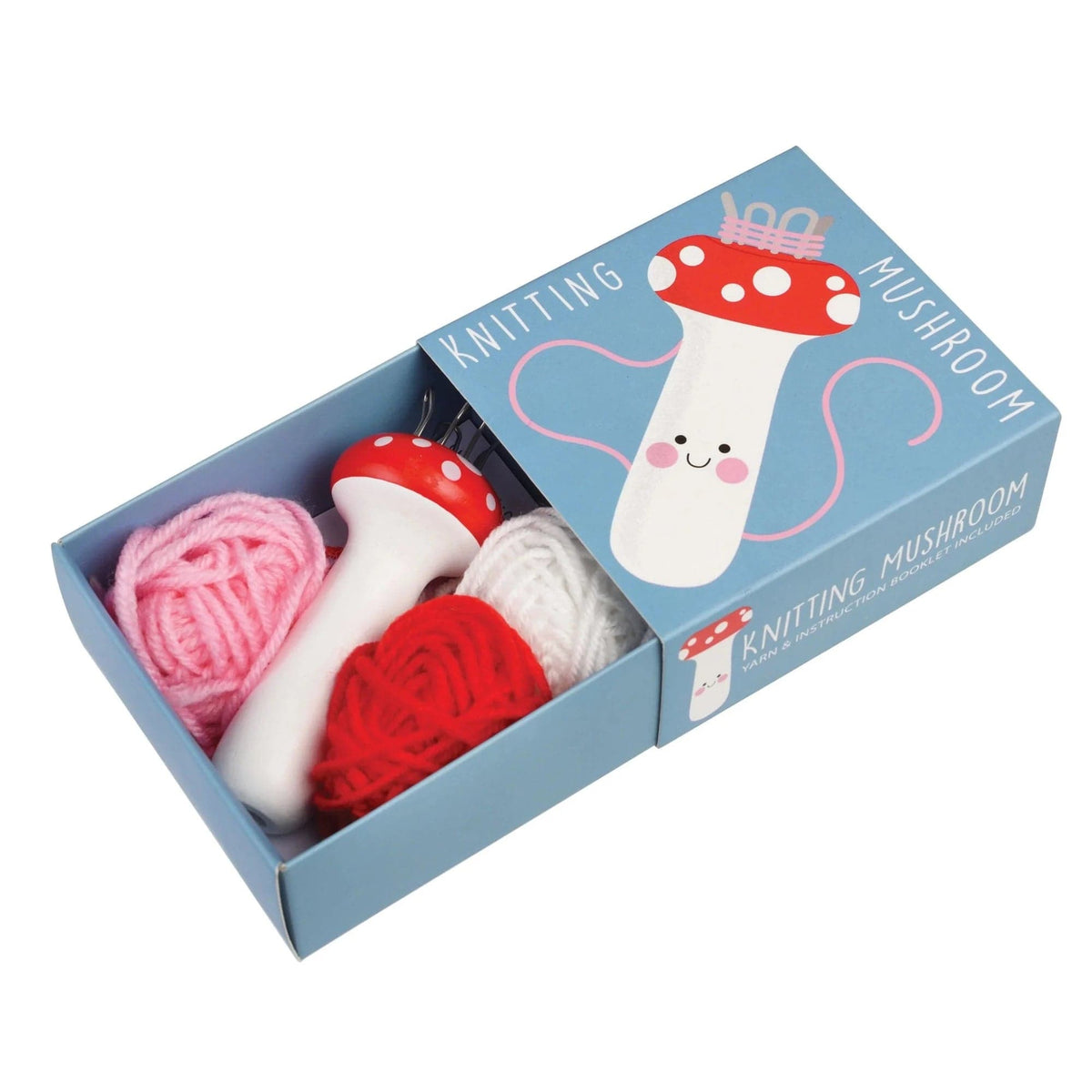 A mushroom-shaped spool knitter with multicolored yarns and a wooden needle, packaged in a blue box with a smiling mushroom illustration.