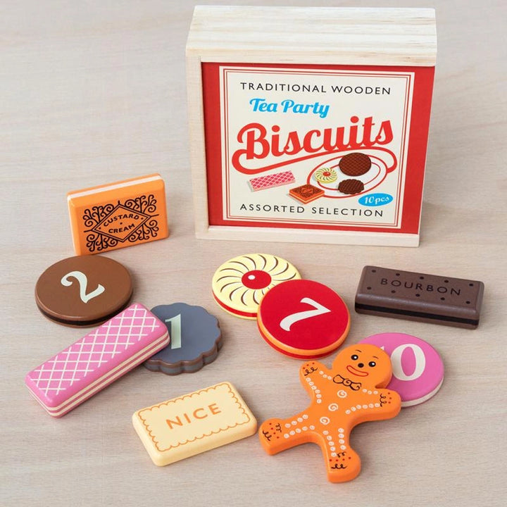 wooden biscuits play set featuring traditional biscuits - gingerbread man, bourbon, pink wafers and other classics. The biscuits are numbered on the back for a fun educational twist and come in a retro style wooden box. 