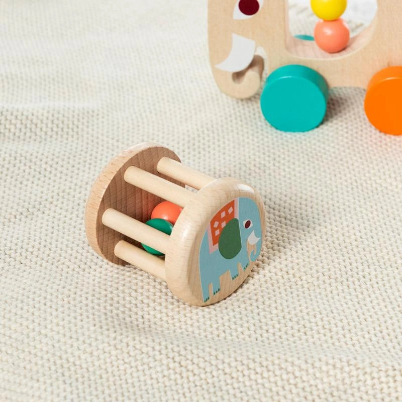 wooden rolling rattle for babies and toddlers with retro animal designs. The rattle features an elephant and painted on one end and has three colourful wooden balls inside that rattle when baby shakes or rolls it. Suitable from birth. 