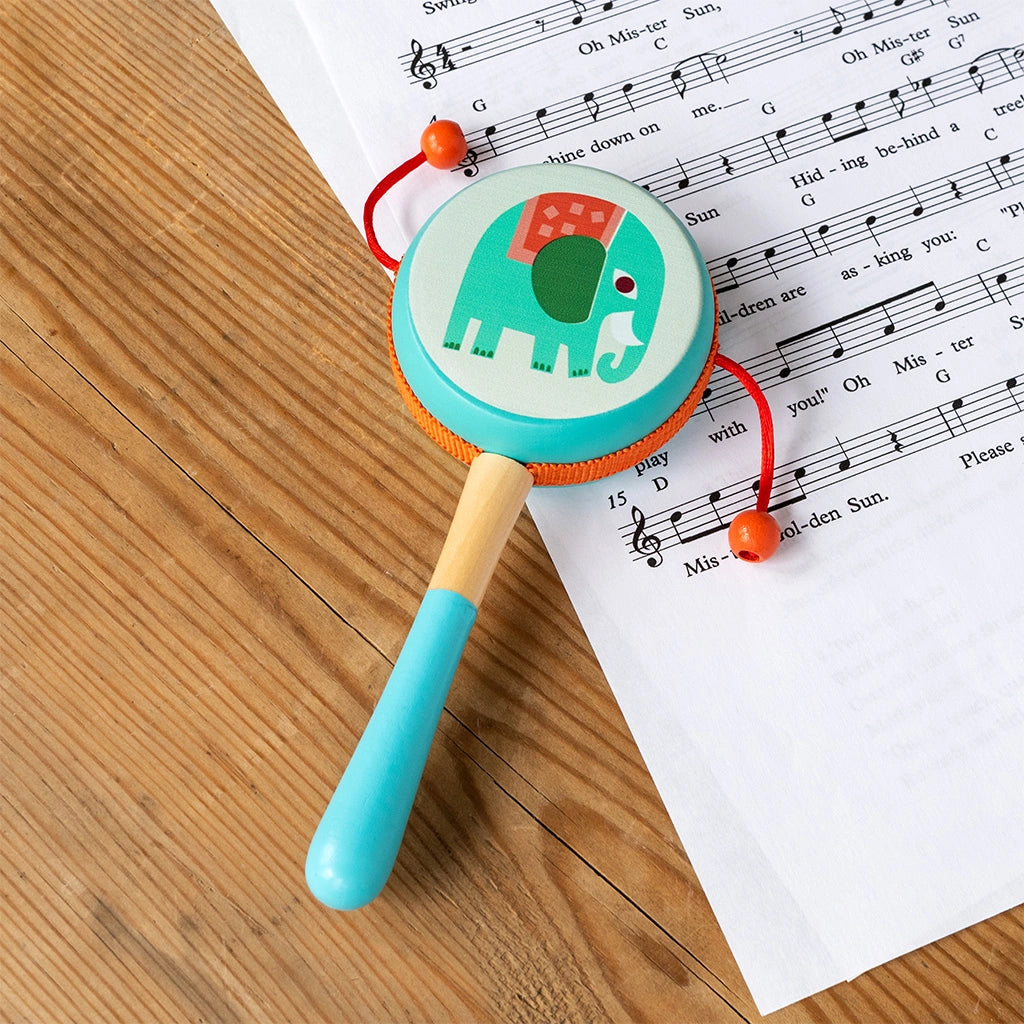 wild wonders rattle hand drum with blue elephant illustration and blue wooden handle. for age 3 and over.