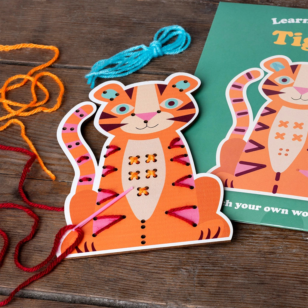 Tiger Learn to Sew Kit with stitches added to the board - kids craft kit for developing fine motor skills and creativity