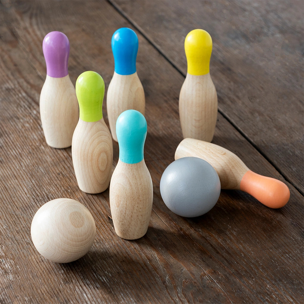 rex london wooden skittles game set up on a wooden floor. ten pin bowling at home for kids age 3 and over.