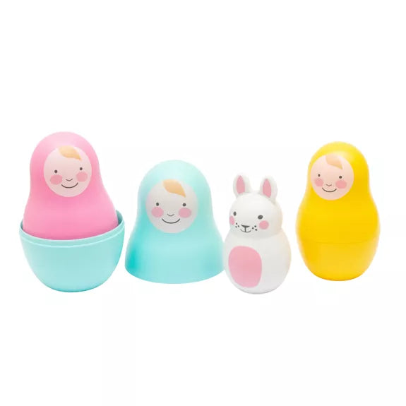 Rosa + Bo Rainbow Nesting Dolls in pink, blue and yellow with a with white bunny toy inside. For babies aged 12 months and over 