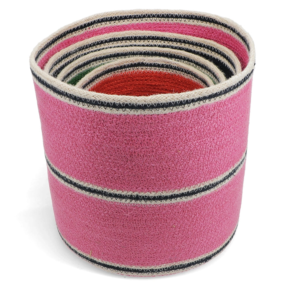 Pink woven basket with colorful stripes on a white background, smaller colour baskets are nested inside