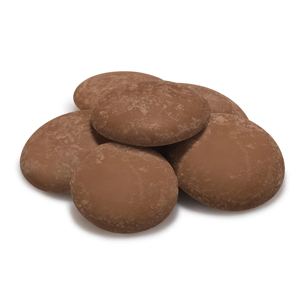 pile of salted caramel milk chocolate buttons made by Cocoba