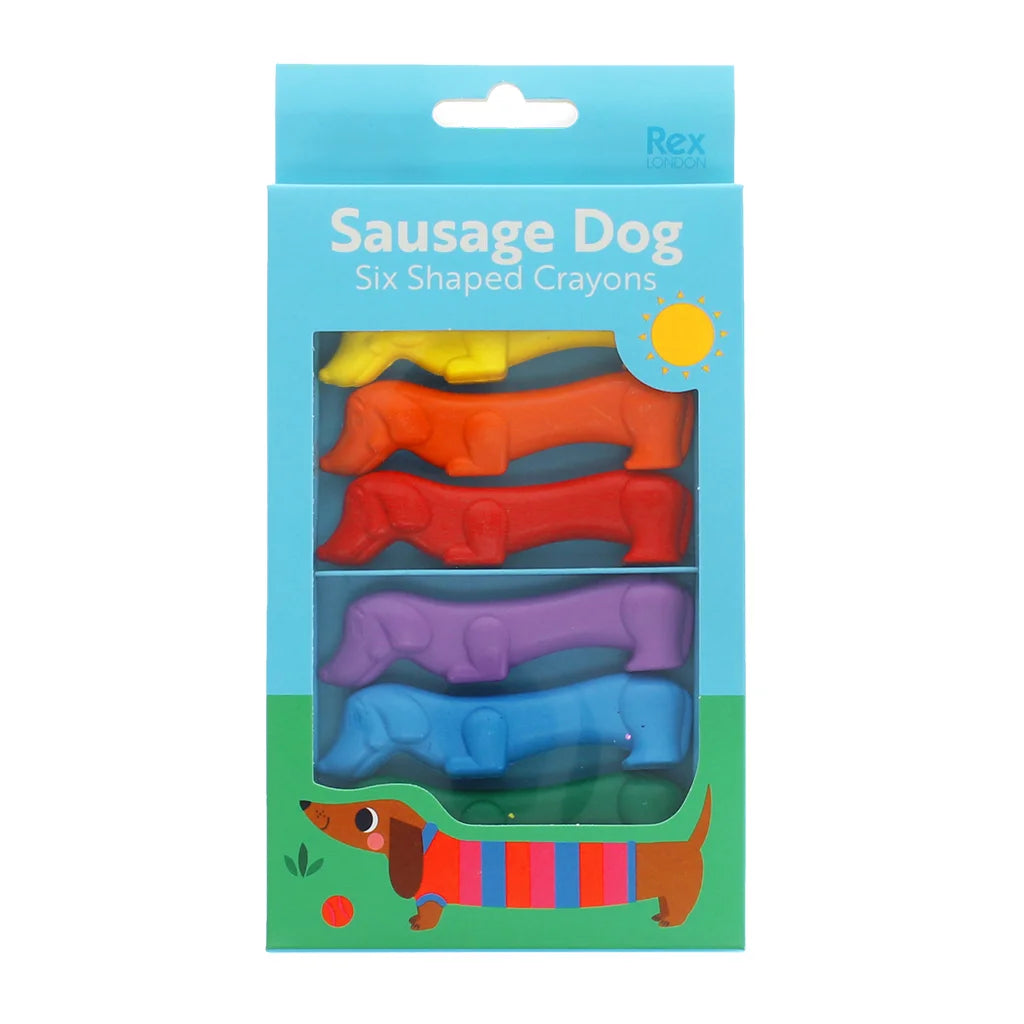 Packaging of six shaped crayons designed like sausage dogs on a blue background.