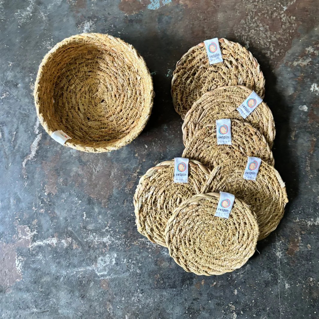 Jute baskets and yarn on a textured surface