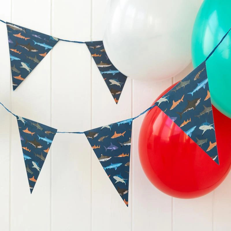 shark party bunting hung with balloons 