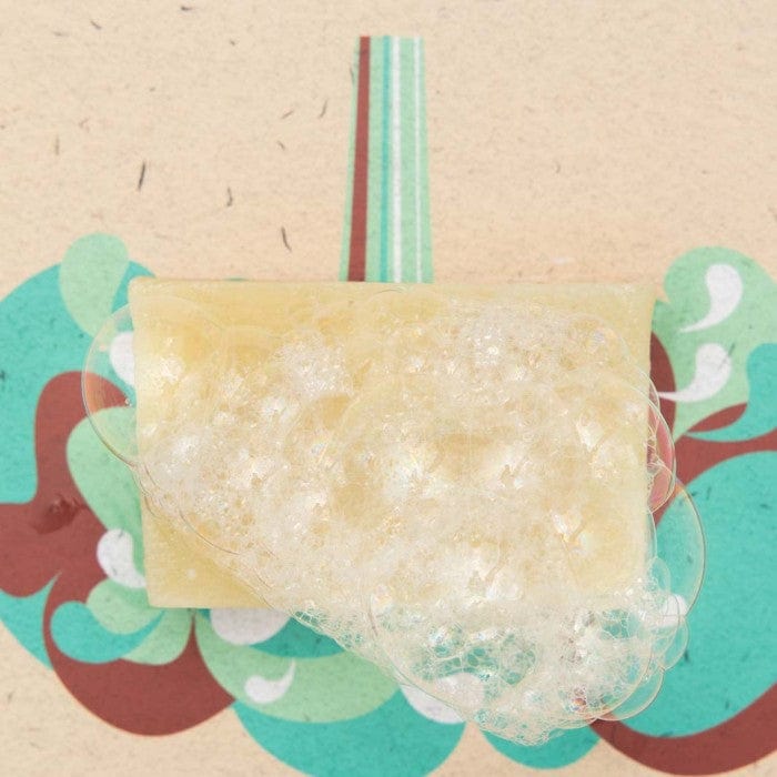shower blocks bar with bubbly lather on a colourful background