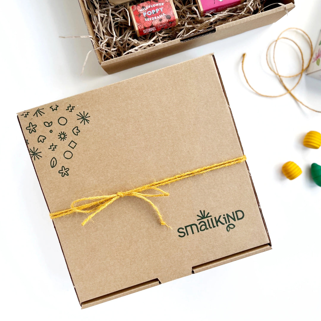 smallkind hand stamped kraft gift box tied with mustard yellow twine