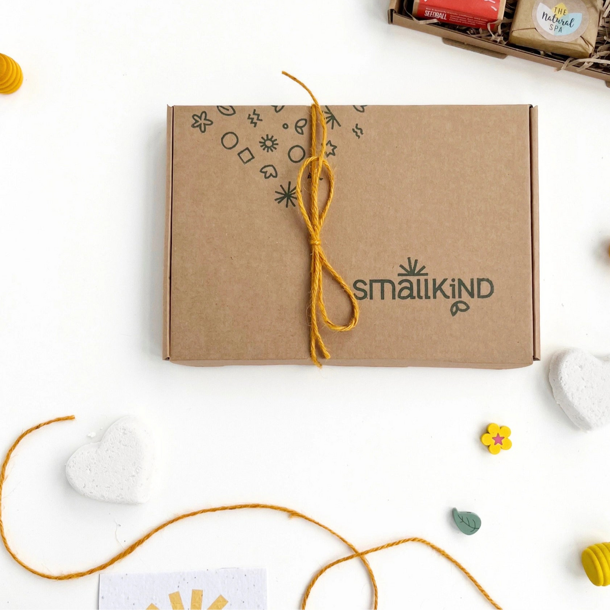 smallkind hand stamped gift box tied with mustard yellow jute twine
