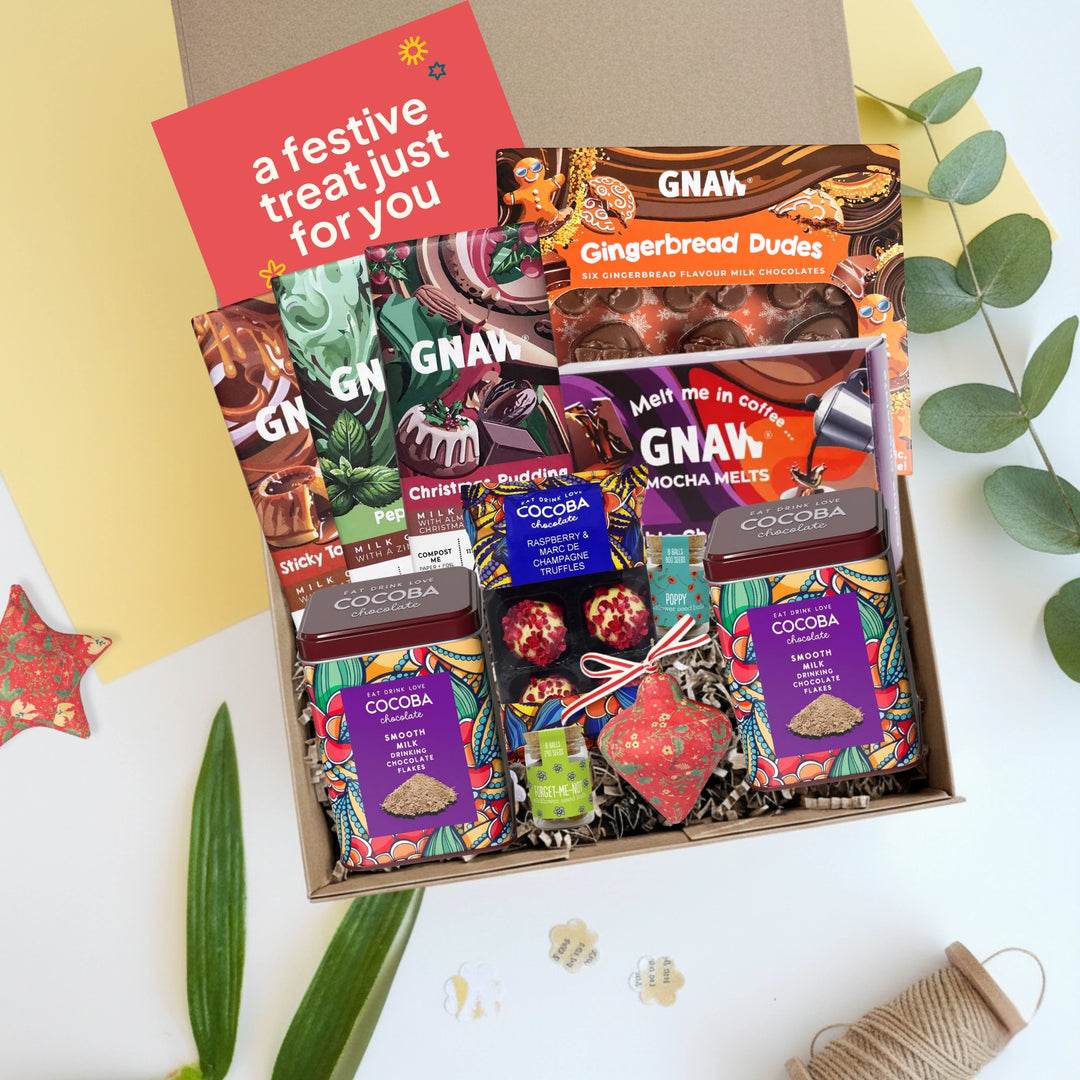 team Christmas hamper with assorted Christmas-themed treats on a white background.