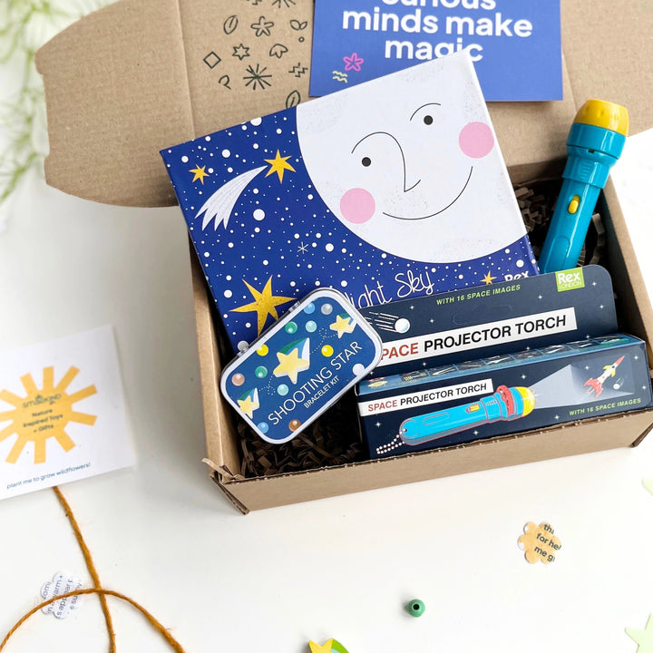 Children's space-themed gift set with craft kit, glow in the dark stars and 'Space Projector Torch' in a kraft gift box.