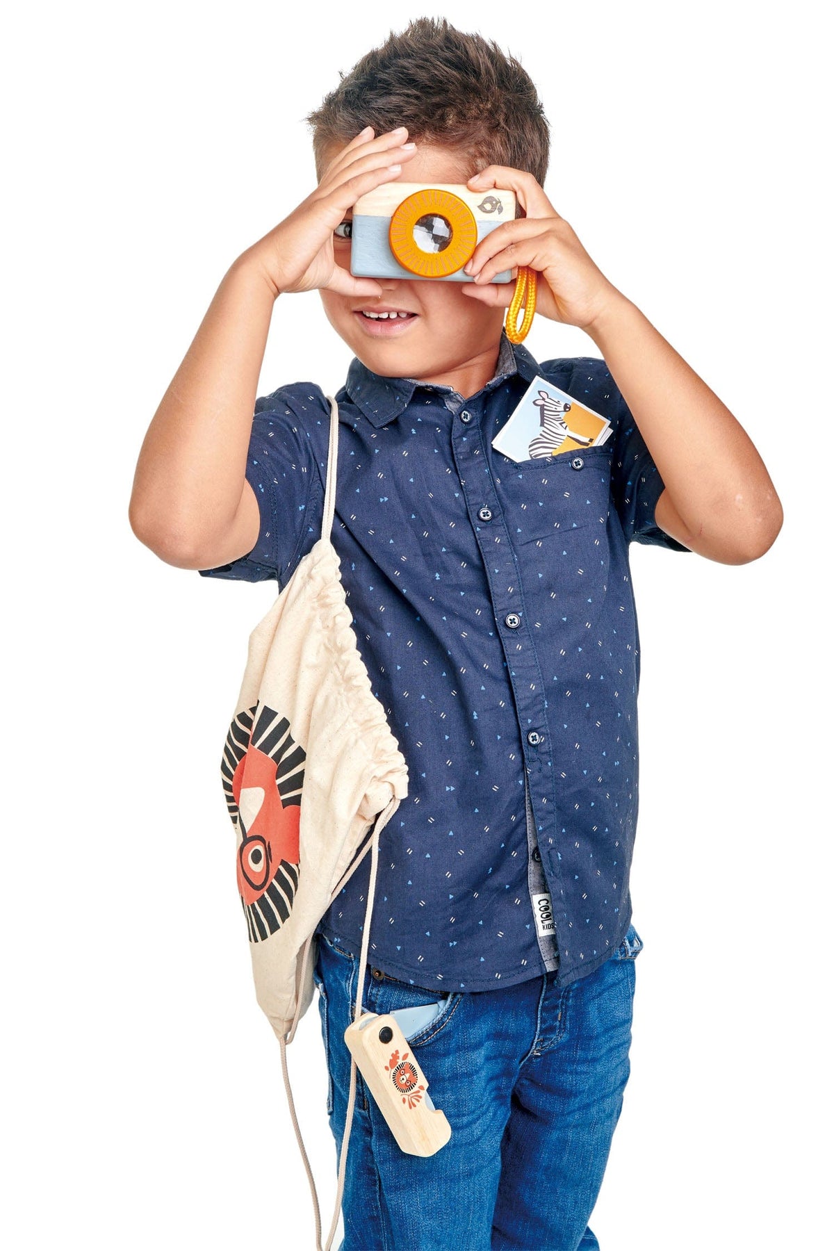 Boy with a wooden camera and bag from the Tender Leaf Safari Adventure Play Set