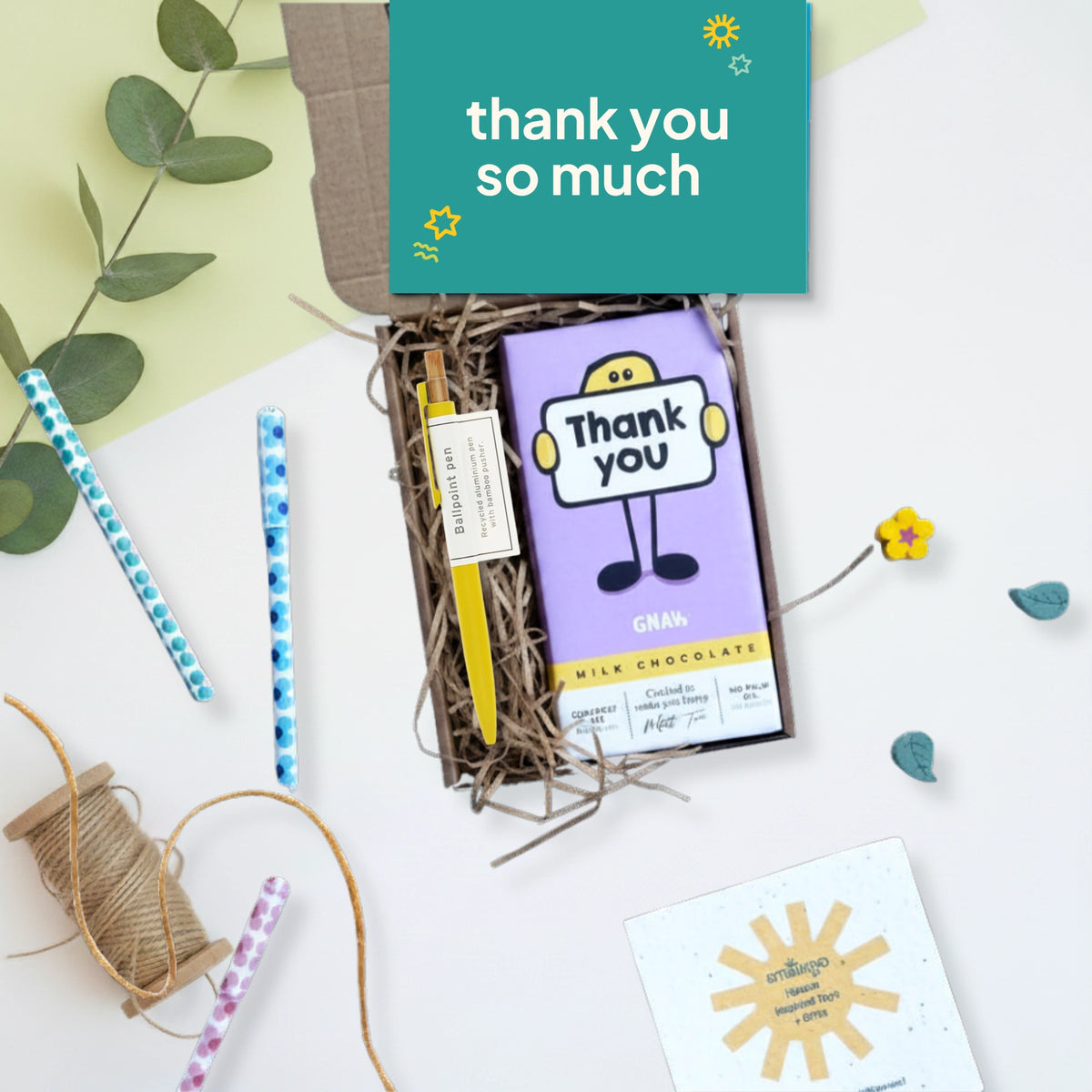 gift box with thank you chocolate bar, yellow pen and a green thank you card