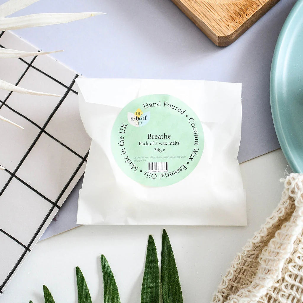 pack of 3 coconut wax melts in compostable packaging on a pastel coloured background