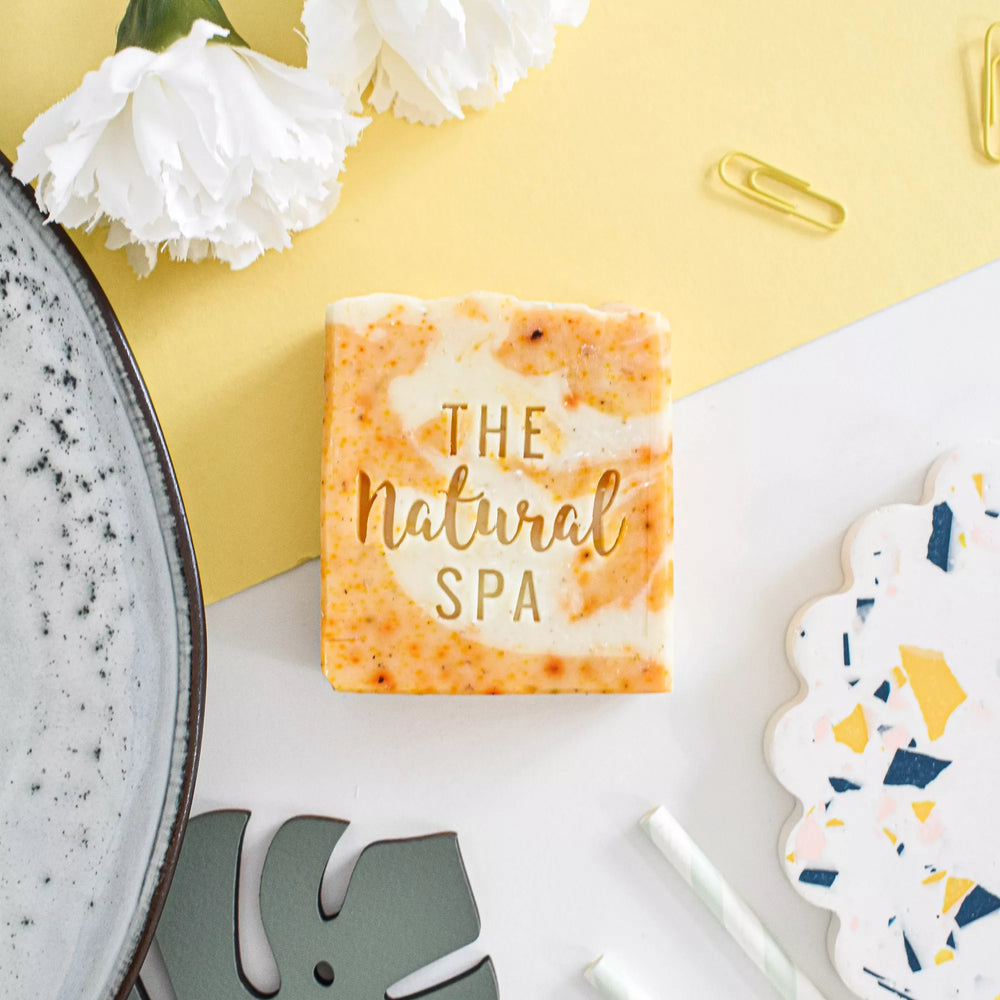 rosemary and clementine soap bar by The Natural Spa on a light background