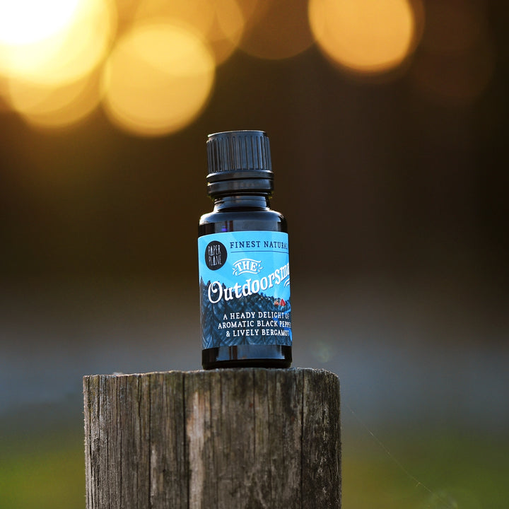 A small dark glass bottle of &