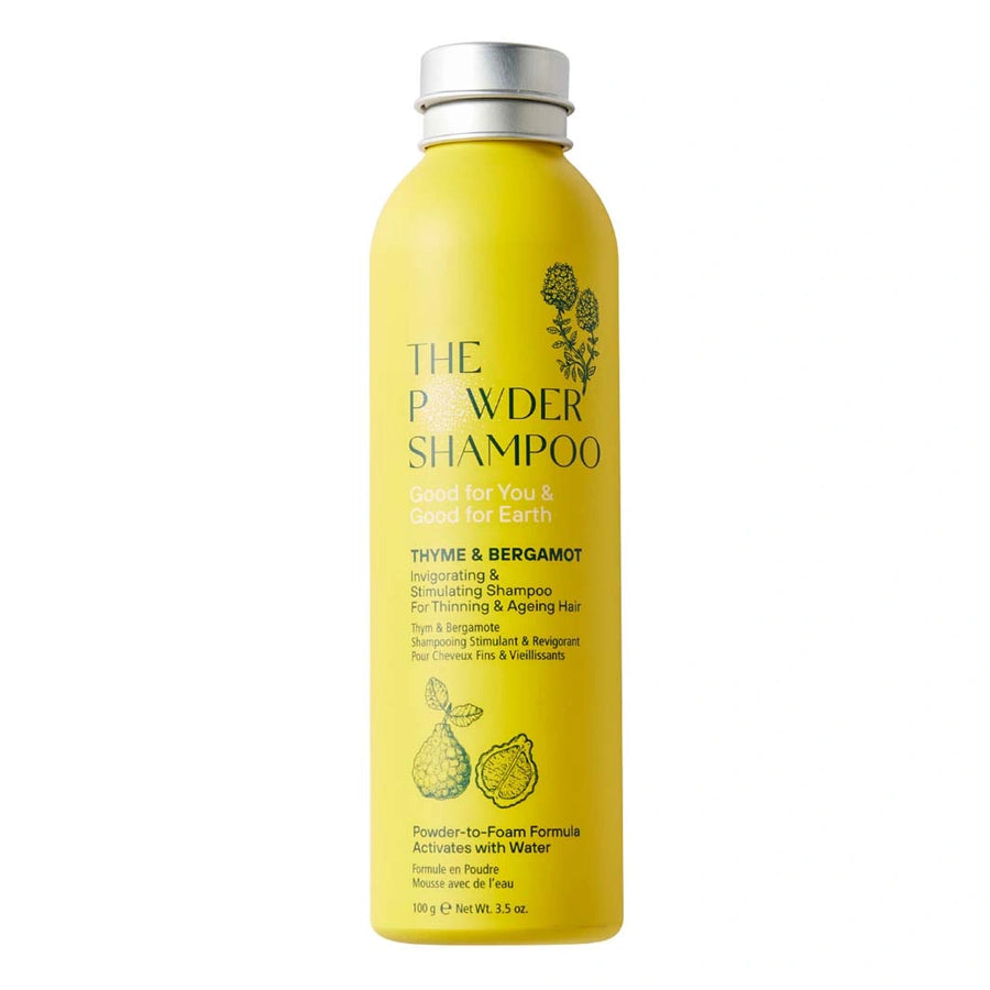 the powder shampoo thyme and bergamot invigorating and stimulating shampoo for thinning and ageing hair in a  yellow aluminium bottle