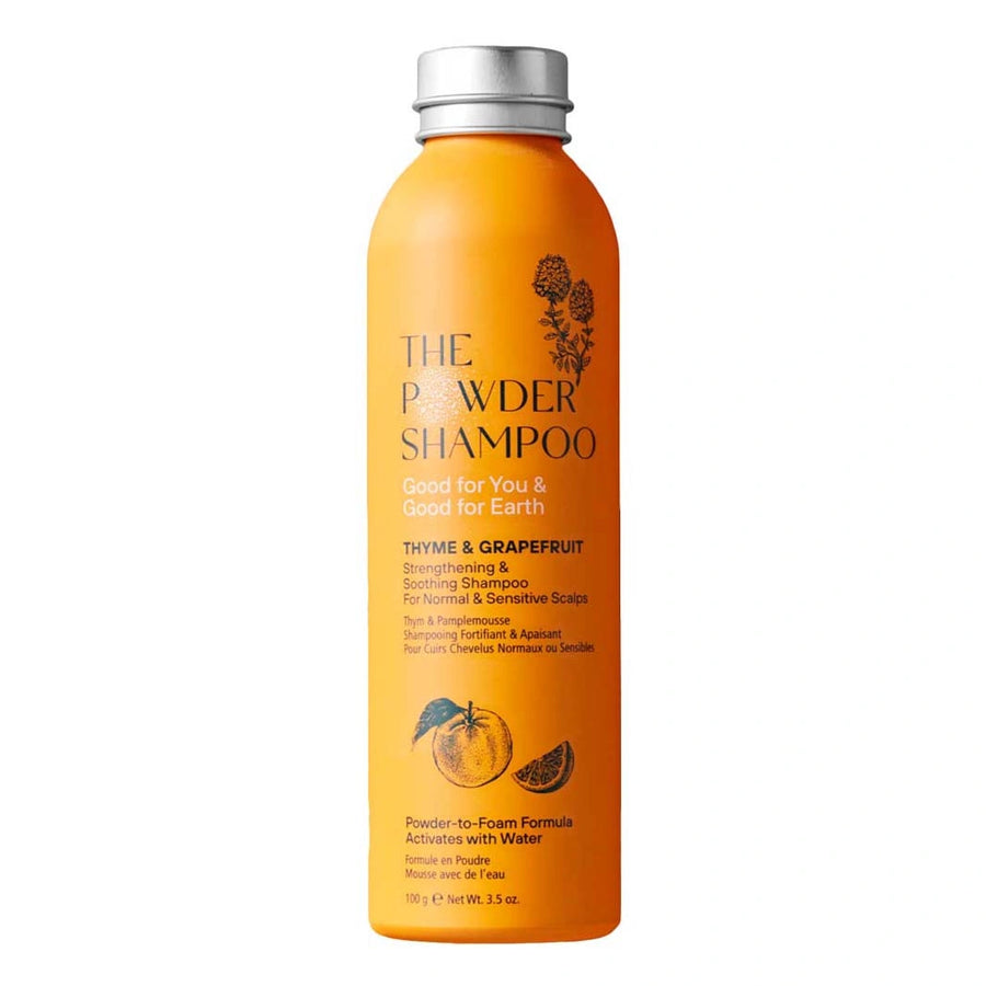 thyme and grapefruit strengthening and soothing powder shampoo in an orange aluminium bottle