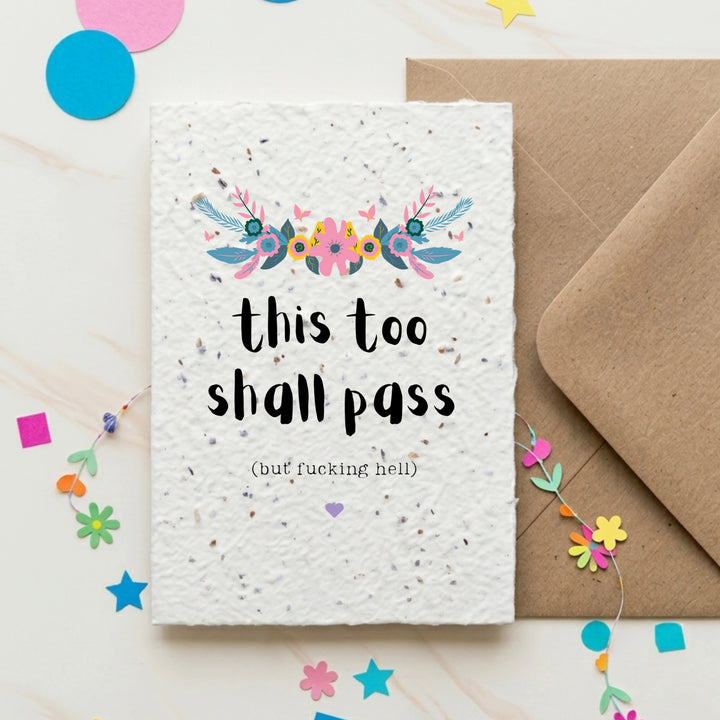 Greeting card with 'this too shall pass' text and decorative elements on a white background.