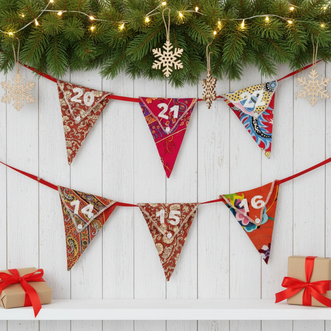 Decorative Christmas reusable advent calendar banner with numbers, surrounded by festive decorations on a light wooden background.