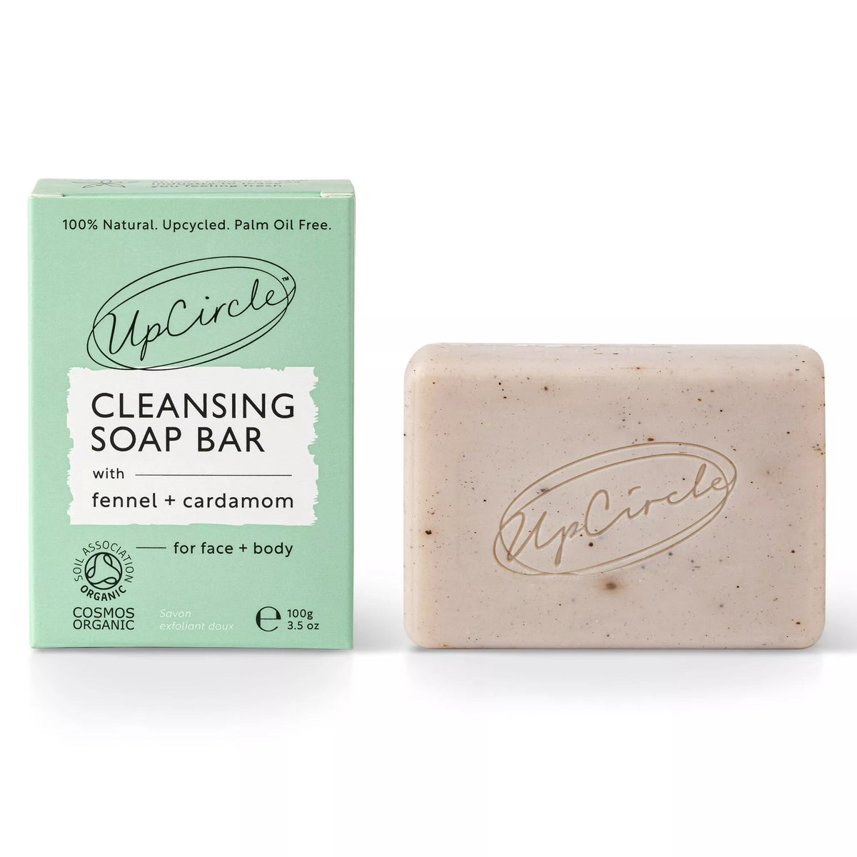 UpCircle Cleansing Soap Bar with Fennel + Cardamom. The bar is a cream colour with flecks from the spices and the upcircle logo is stamped in the centre