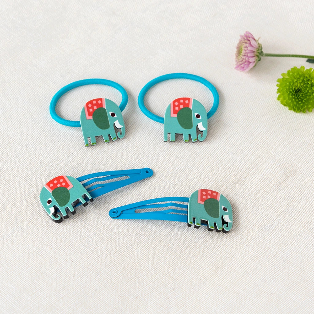 Rex London hair ties and hair clips for kids. Green and blue wooden elephant decorations on blue hair bands and blue metal clips