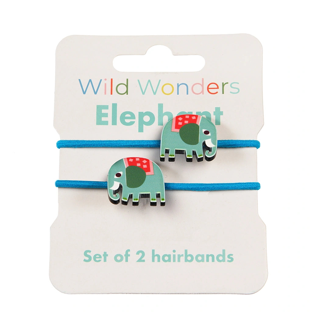 Two Wild Wonders elephant hair ties by Rex London on a  white backing card. Green and blue wooden  elephant decorations on blue hair bands. 