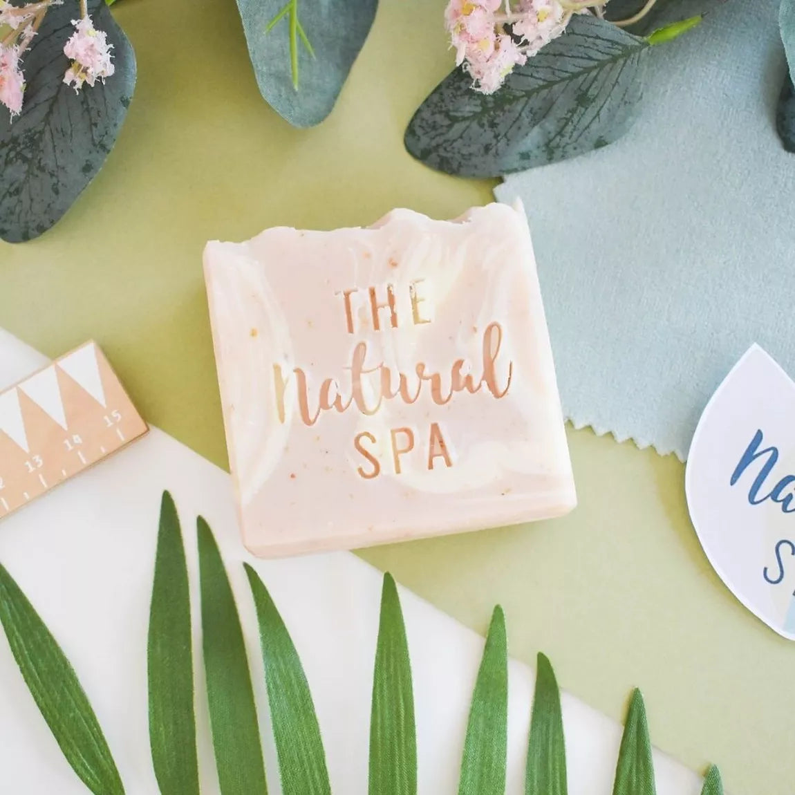 wildflower wisp natural soap bar on a light background with leaves 