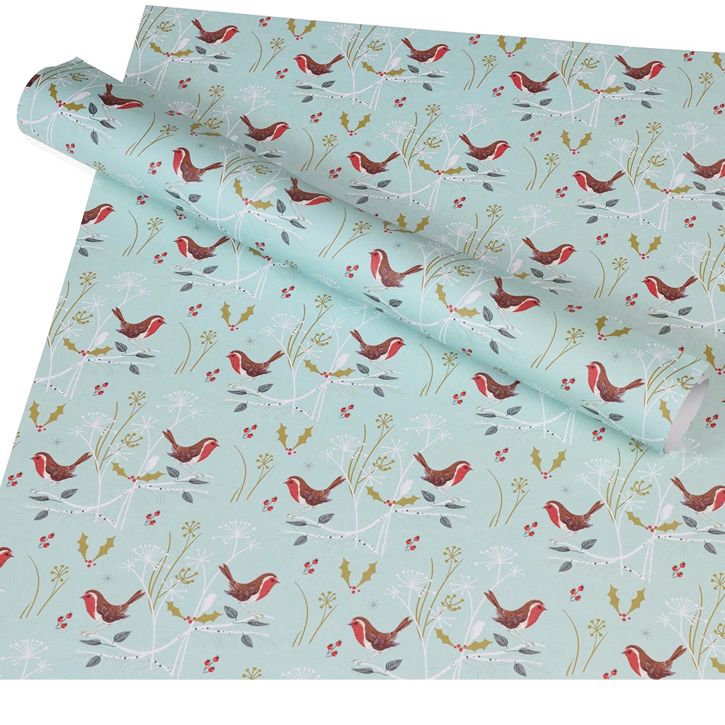sustainable Christmas gift wrap sheets with a robin, holly and plant print on a light blue background