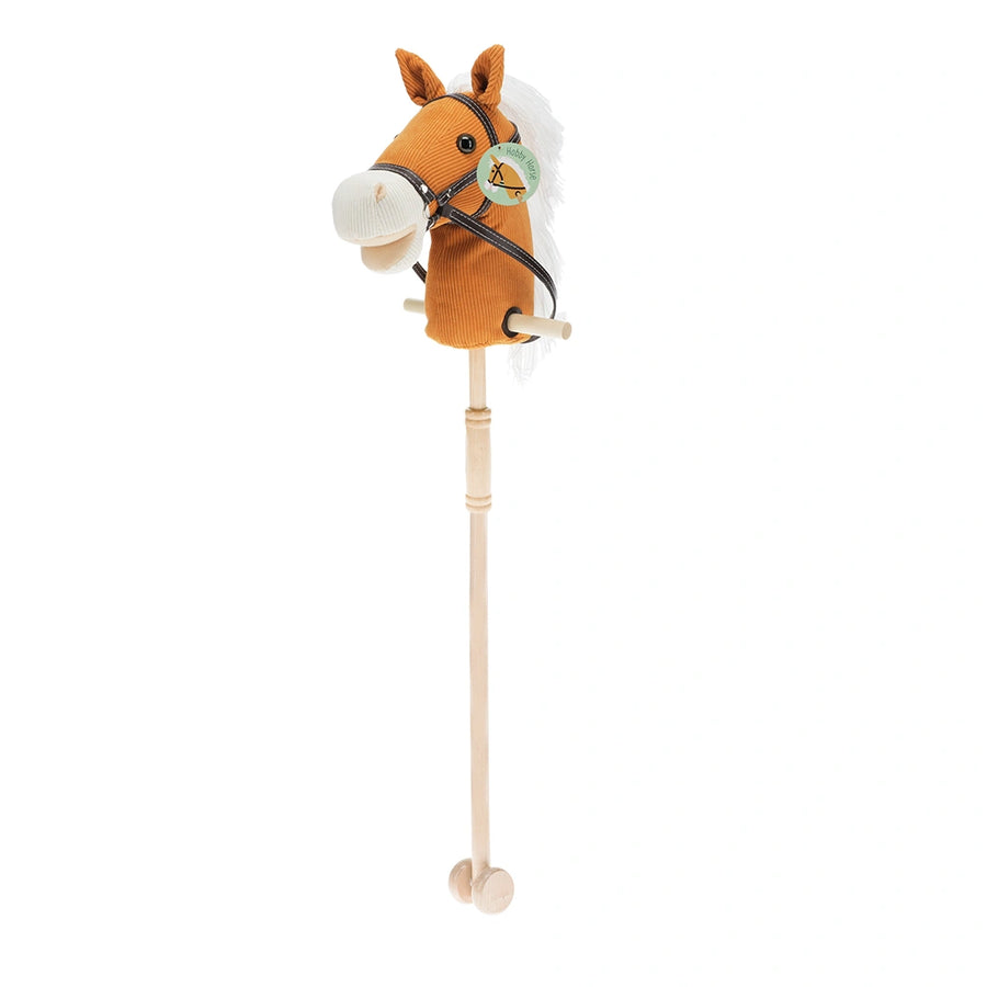 Plush hobby horse toy with a stick on a white background