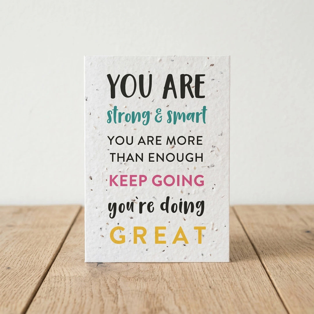 Motivational card with text on a wooden surface