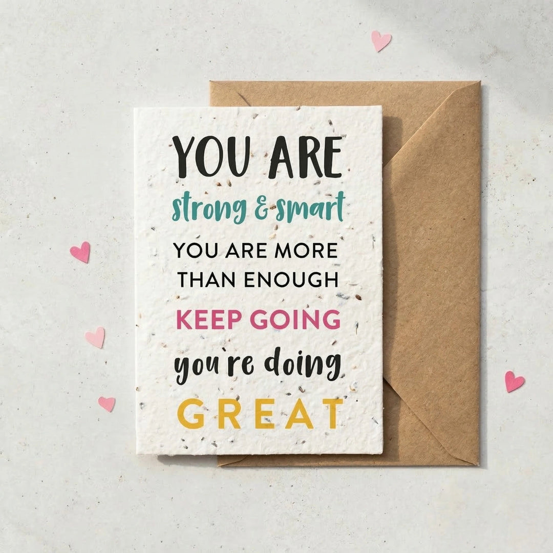 Motivational card with text and a brown envelope on a light background