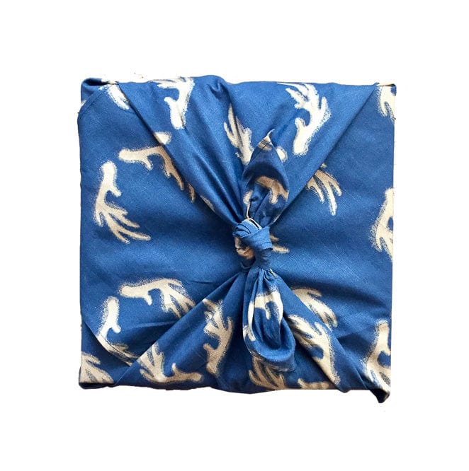 midnight blue fabric gift wrap with white reindeer antler print