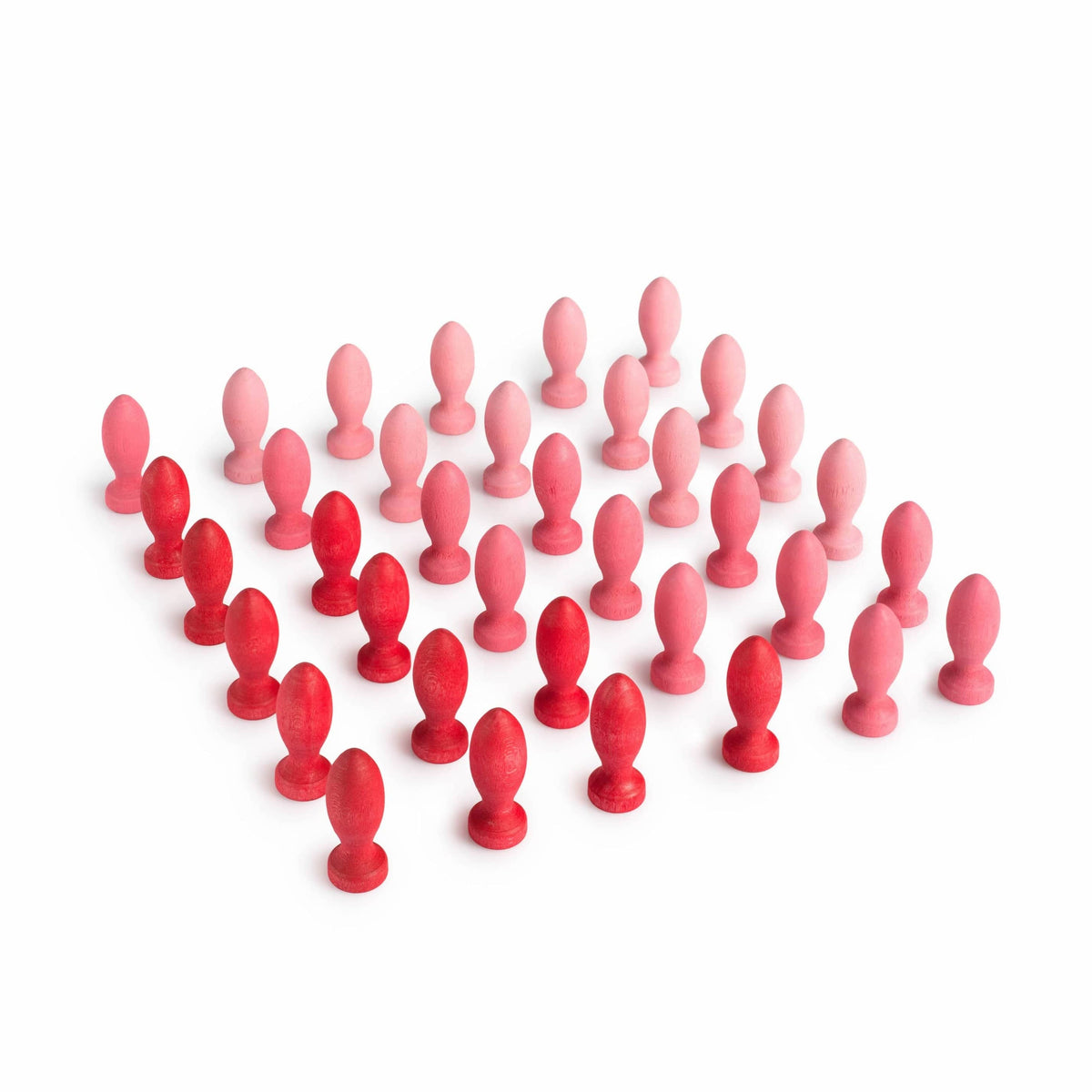 A collection of wooden flower petals in various shades of pink arranged on a white background.