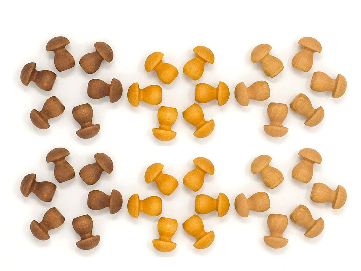 A collection of Grapat wooden mushrooms in shades of natural, yellow, and brown, arranged on a white background.