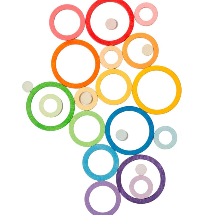 Colourful circular wooden rings on a white background