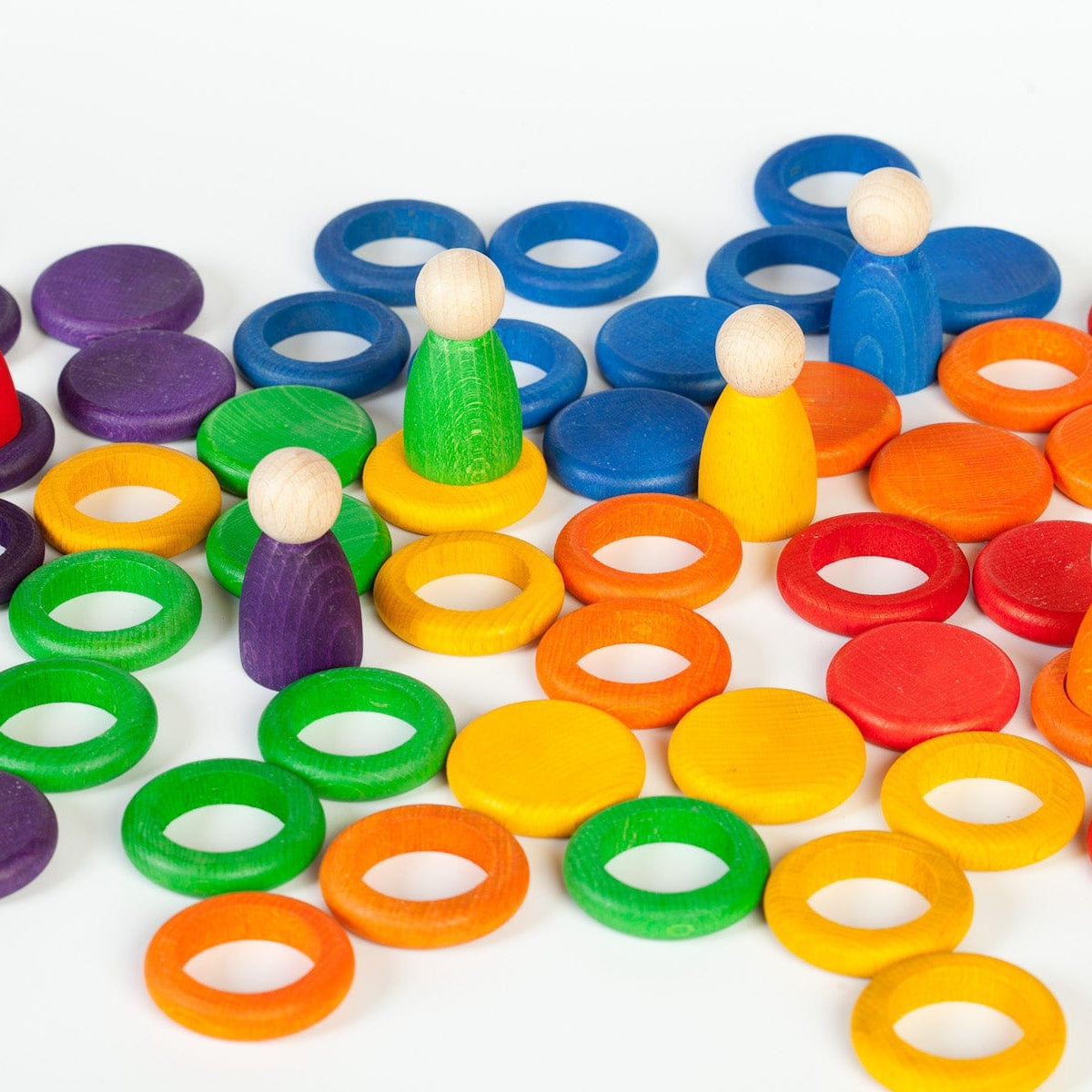 Grapat Nins Rings + Coins in rainbow colours on a white background 