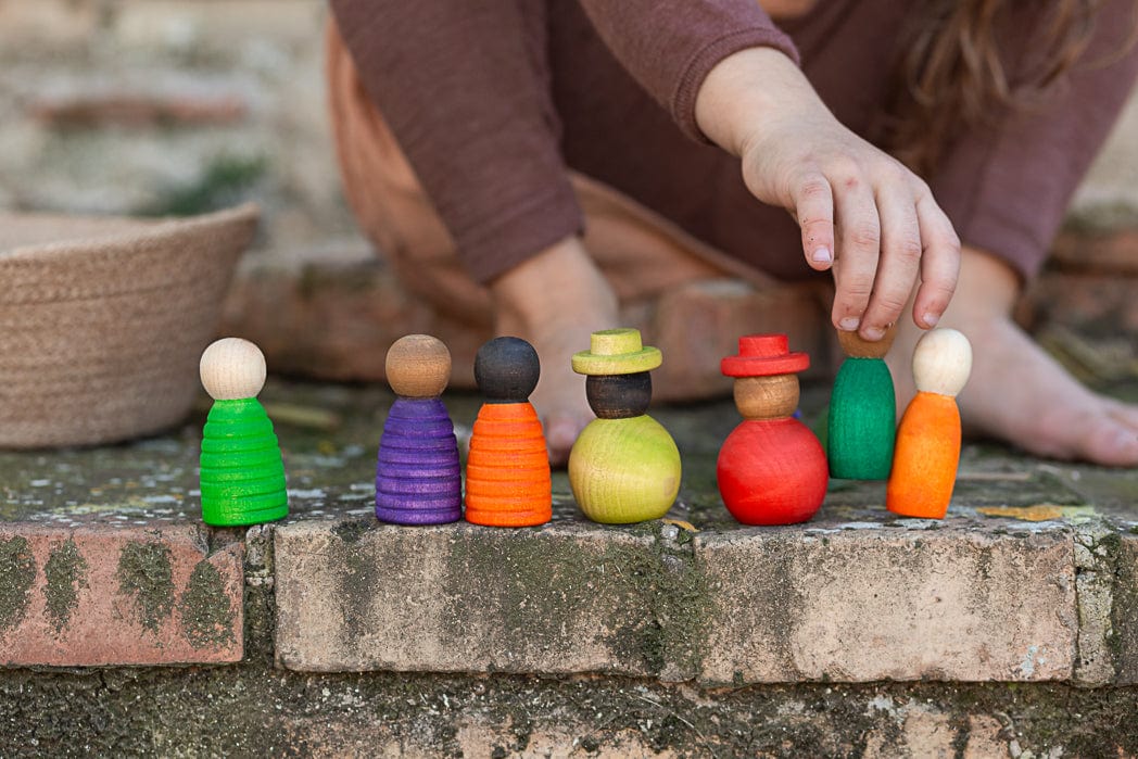 grapat together wooden figures multicultural