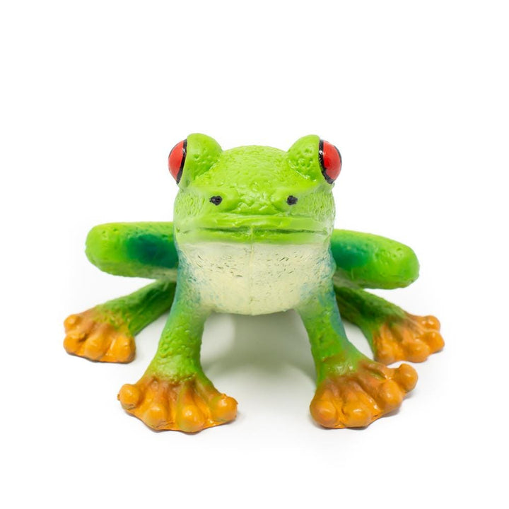 rubber tree frog toy with red eyes