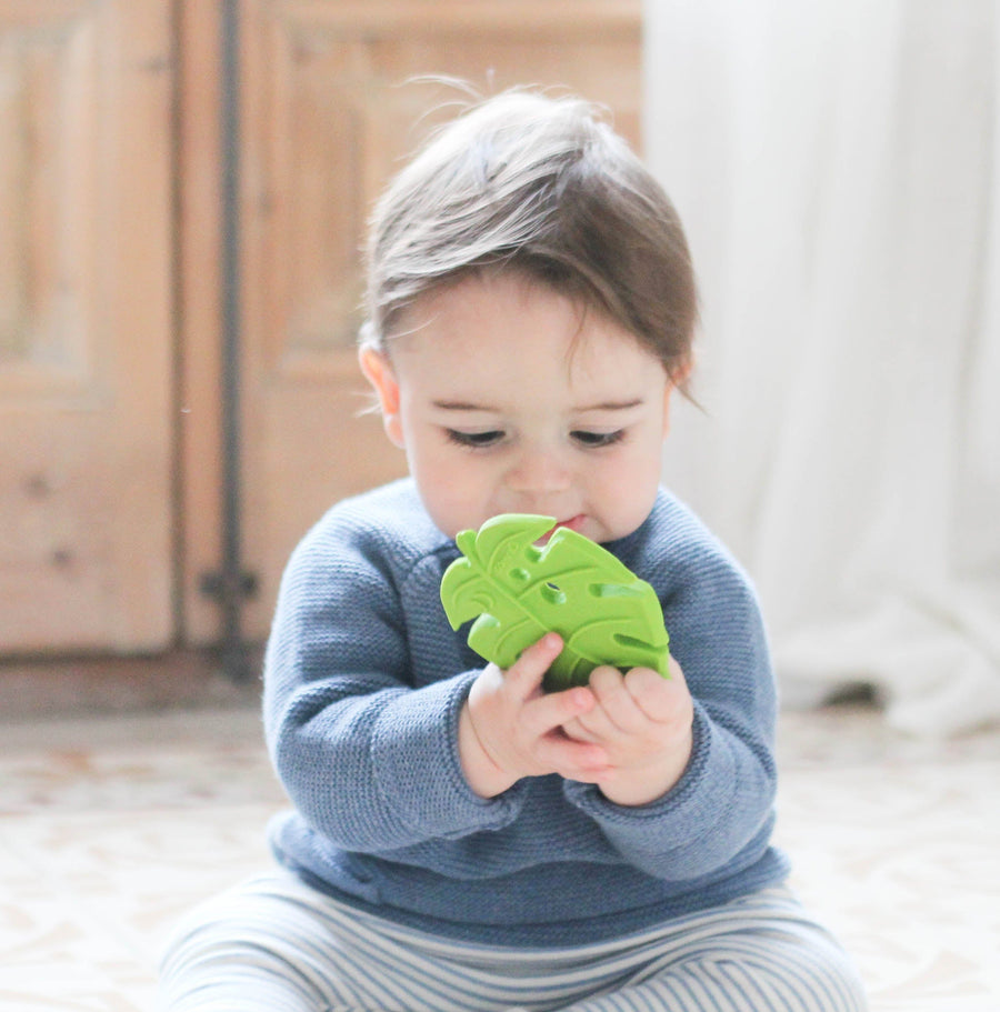 baby holding Lanco Monstera Leaf Teether 