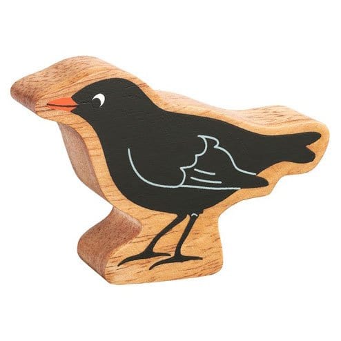 A toy blackbird figure with a natural wooden base, painted on both sides.