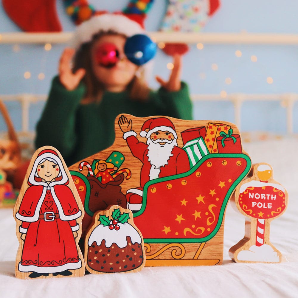 wooden father christmas, mrs claus, North Pole sign and christmas pudding play figures. For children aged 10 months and over