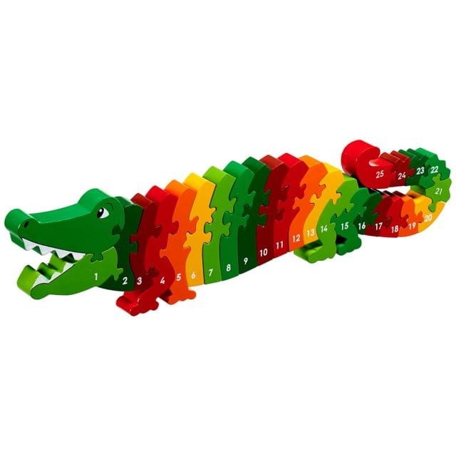 A colorful wooden crocodile-shaped jigsaw puzzle with numbered pieces, designed for children.