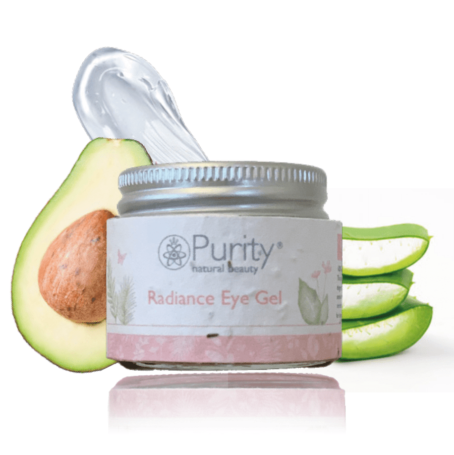 glass jar of radiance eye gel ona white background with avocado slices in the background