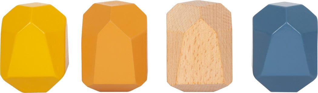 four geometric wooden blocks painted yellow, ocre, blue and one left natural