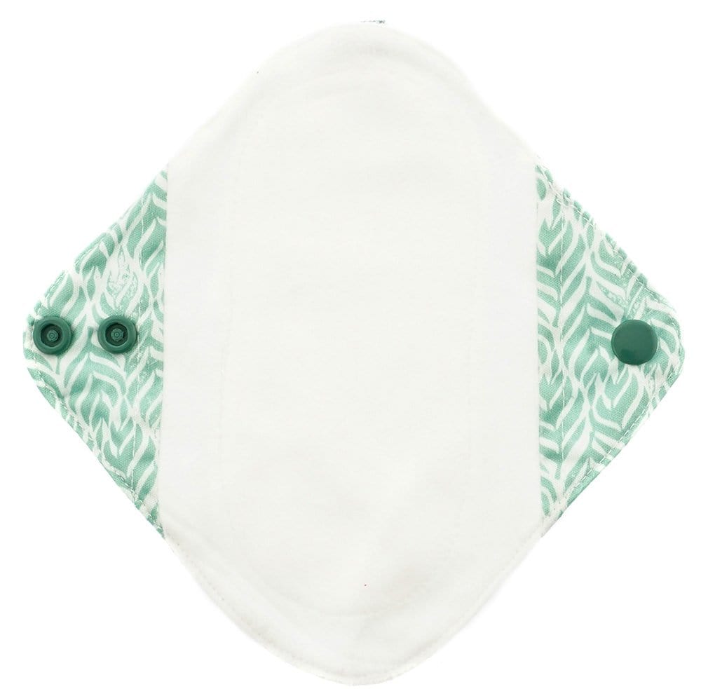 light period pad and panty liner with a  green geometric print and fleece top